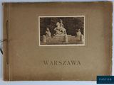 un vieux livre sur lequel figure l'image d'une femme assise sur un banc