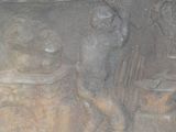 a statue of a man and a woman sitting at a table