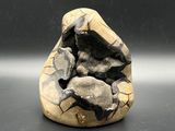 a small rock with a hole in it on a table
