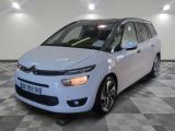 the white citrole is parked on a checkered floor