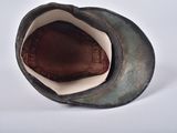 a close up of a hat on a white surface