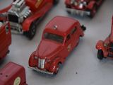 a lot of toy cars that are sitting on a table