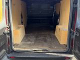 the back of a van with the door open and the back of the van open