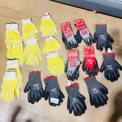 many pairs of gloves that are on the floor