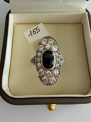 an image of a ring in a box with a price tag on it