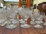 a lot of wine glasses sitting on a table