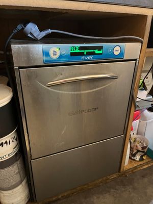 an image of a dishwasher that is in a kitchen