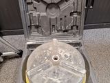 a plastic case with a yellow disc inside of it