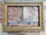 a picture of a picture frame on a brick wall