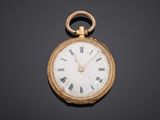 an antique gold pocket watch with roman numerals and roman numerals