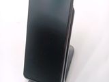 a phone that is sitting on top of a stand
