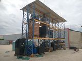 an image of a storage rack with barrels and barrels