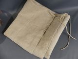 a close up of a bag on a table next to a pair of scissors