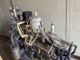 a machine that is sitting in a room with pipes