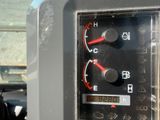 a close up of a car ' s dashboard with a speedometer