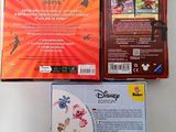 two disney figurines are sitting next to each other on a table