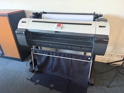 an image of a large format printer in a room