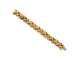gros plan d'un bracelet en or avec des pierres multicolores