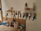 a workbench with many tools on it in a room