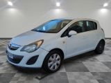 a picture of a small white car parked in a garage