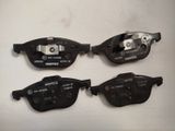 four different types of brake pads are shown on a white surface