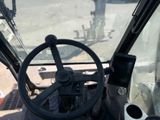 a steering wheel of a tractor on the street