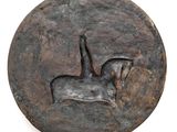an image of a bronze coin with a horse and rider on it