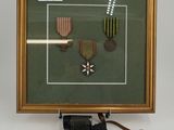 a picture of a framed picture with a pair of binoculars next to it