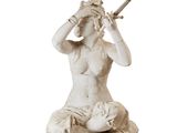 statue of a woman with a sword on a wooden pedestal