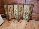 four paneled room divider with flowers and birds painted on it