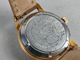 an image of a close up of a wrist watch with a leather strap