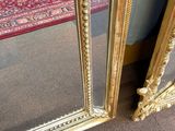 two mirrors that are sitting next to each other on the floor