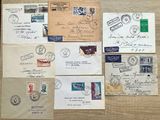 many different types of letters and envelopes laid out on a table