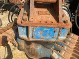 a rusted out machine that is sitting in the dirt