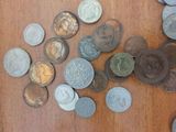 a lot of coins that are on the table
