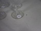 several empty wine glasses sitting on top of a white table