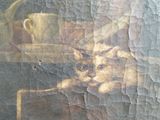 a painting of a cat that is sitting on a table