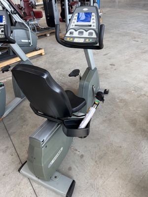 a stationary exercise bike in a garage with other equipment