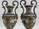 pair of vases on a white surface with a white background