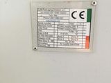a sign on the side of a machine in a room