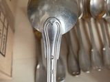 someone is holding a spoon and a spoon rest in their hand