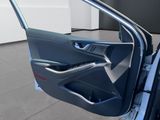 the interior of a car with the door open and the driver ' s seat down