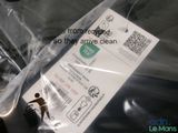 a plastic bag with a sticker on it that has a picture of a person on it