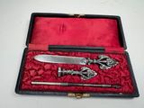 a silverware set in a red case on a table