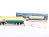 a small toy truck with a box on the side