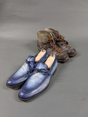 two pairs of blue shoes are sitting next to each other