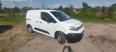 a white van that is parked on the side of the road