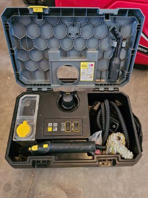 a tool box with tools in it sitting on the floor