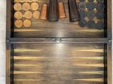 an image of a wooden backgam board with several pieces of wood in it