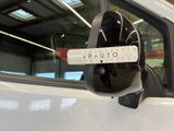 a close up of a car mirror with a sticker on the side of it
